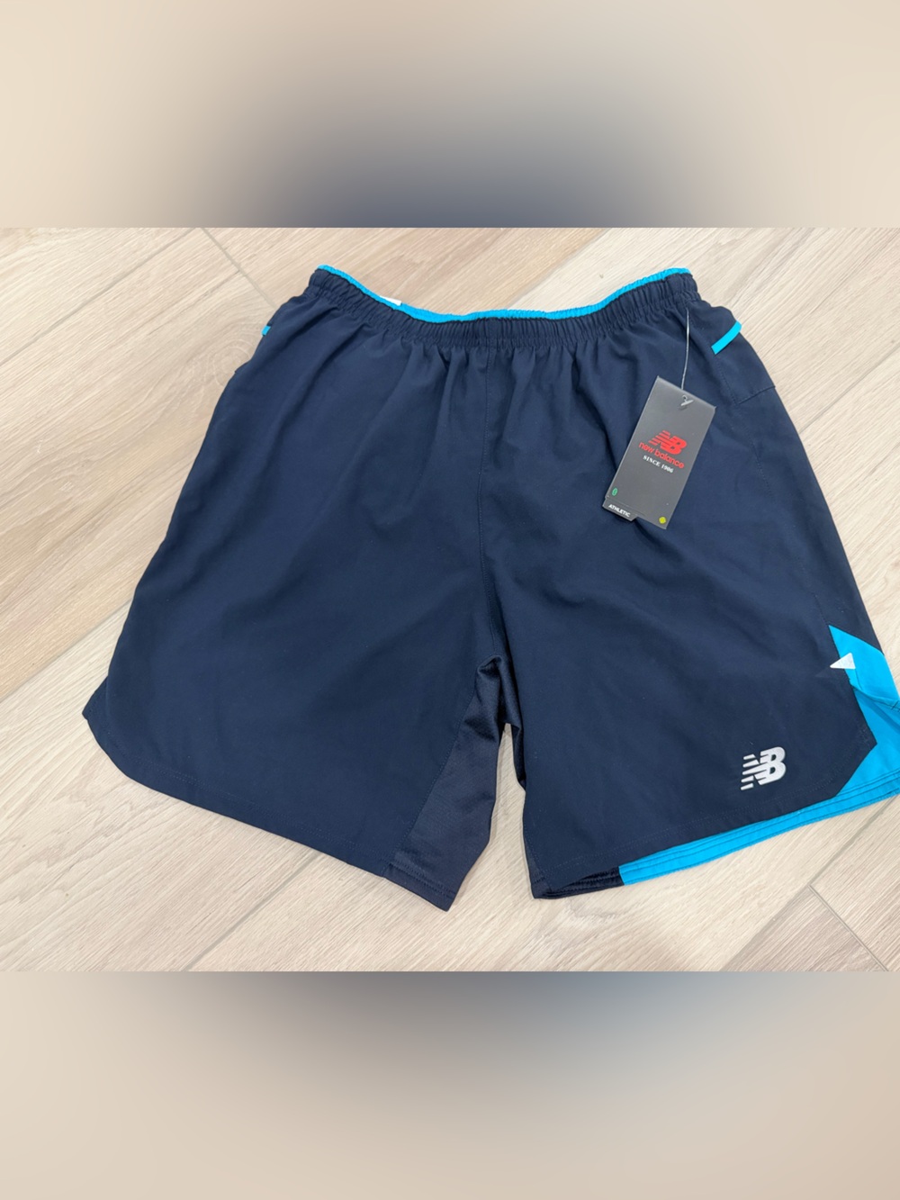 New Balance Navy Shorts with Bright Turquoise Accents